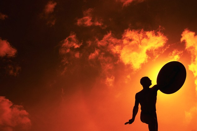 Warrior Statue Silhouette and Orange Sky